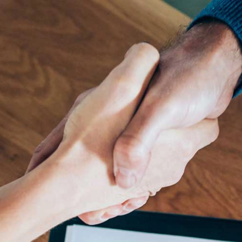 two people shaking hands